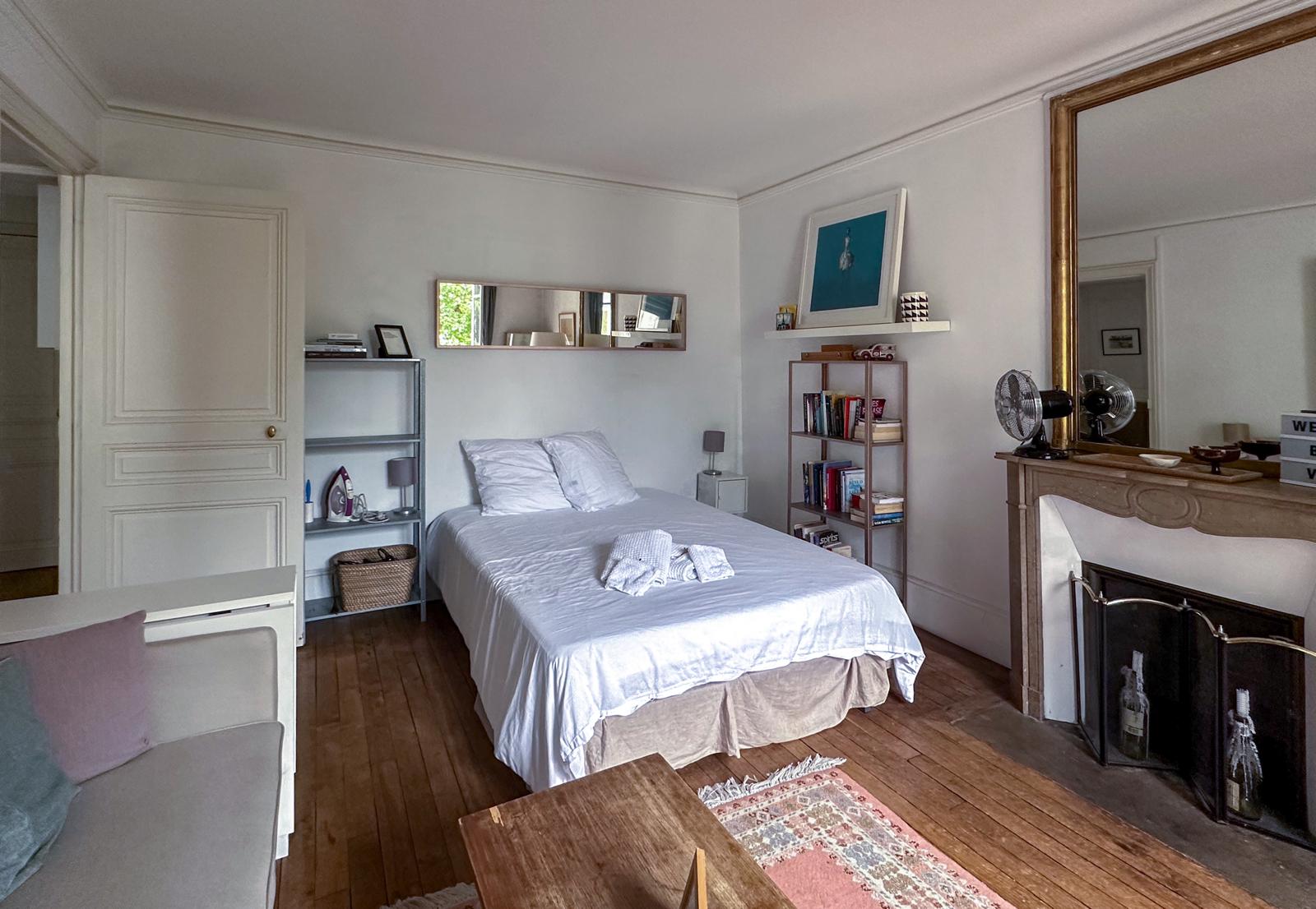 Bedroom with ornate mirror